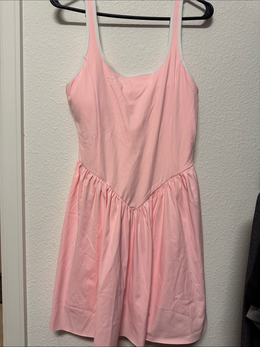 Pink athletic dress with subtle Mickey detail